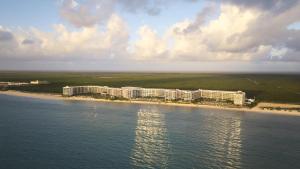 an aerial view of a resort on a beach at Hilton Cancun, an All-Inclusive Resort in Cancún