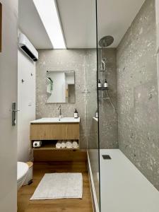 a bathroom with a shower and a sink at FLOK horizon in Malbuisson