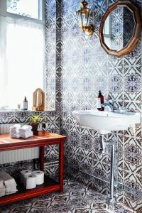 a bathroom with a sink and a mirror at Karlaby kro in Karlaby