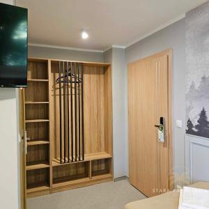 a room with a book shelf and a door at Stara Palmiarnia Mimoza in Rybnik +17 photos