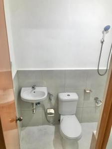 a bathroom with a toilet and a sink at ErrZ Homestay in Malaybalay in Malaybalay