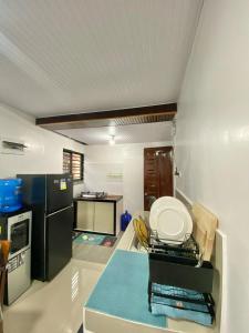 a kitchen with a table with a plate on it at ErrZ Homestay in Malaybalay in Malaybalay +11 photos