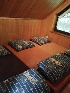 a room with three beds in a cabin at Rychwałd - Full House! in Rychwałd