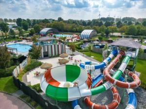 an aerial view of a water park with a water slide at Stacaravan 161 Capfun camping Bongerd 5 sterren Gezin 5 personen in Tuitjenhorn