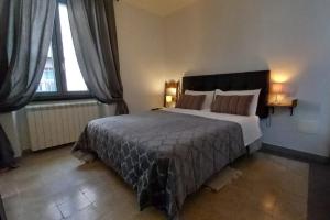 Un pat sau paturi într-o cameră la Casa Vincenti