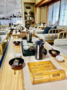a long wooden table with food on top of it at Kanazawa kigen in Kanazawa
