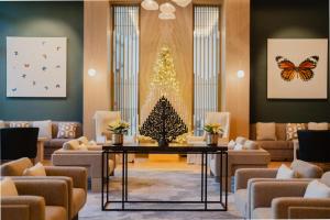 a living room with a christmas tree and a table at Waldorf Astoria Riviera Maya in Cancún