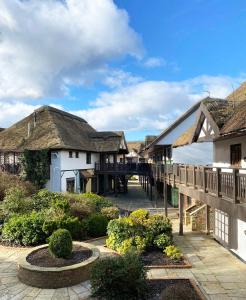 a view of a house with a thatched roof at Owd Nell's Tavern in Garstang