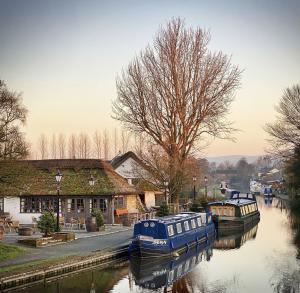 a couple of boats parked on a river at Owd Nell's Tavern in Garstang