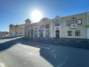 an empty parking lot in front of a building at Central Apartment at Bismarck5 in Swakopmund