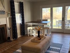 a living room with a table and a couch at Down By The Docks in Oxford