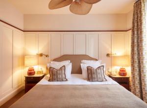 a bedroom with a large bed with two pillows at Hotel de Silhouette in Biarritz +78 photos