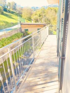 a balcony of a house with birds on it at Appartamento da Mery in Asso