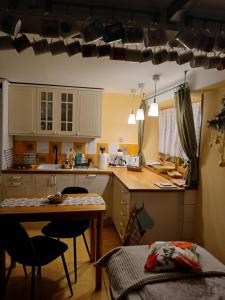 a kitchen with a table and chairs and a counter top at Skalny ogród in Poronin +29 photos