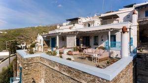 a villa with a view of a house at Tinos Grand Villa 6BR 15ppl Infinite Views in Triandáros