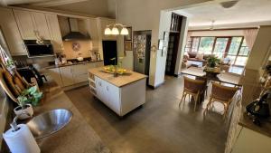 a kitchen with a sink and a counter top at Panorama View Pool House Steiltes I in Nelspruit
