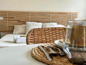 a table with a glass of water and a basket at Il Colle in Buia