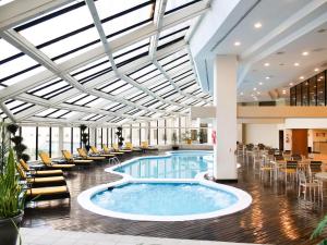 a pool in the lobby of a hotel at MS Milenium Monterrey Curio Collection by Hilton in Monterrey