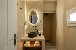 a bathroom with a sink and a mirror at Galation in Mikonos +36 photos