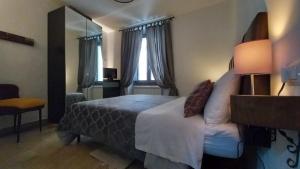 Un pat sau paturi într-o cameră la Casa Vincenti