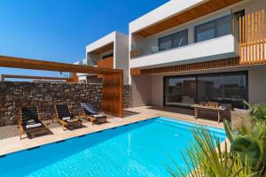 an image of a house with a swimming pool at Aethrion Villas & Suites in Gennadi