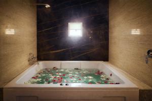 a bath tub filled with lots of candy at Elegant Residency in Coimbatore