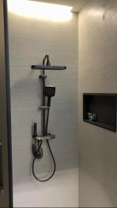 a bathroom with a sink and a shelf with a hair dryer at فندق جولدن نيو سمارت لاكجري - Golden New Smart Hoteluxury in Abha +31 photos