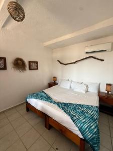 a bedroom with a large bed in a room at Hotel Gilda in Coyuca +46 photos