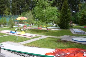 a park with many different types of playground equipment at Waldresidenz in Neubrandenburg