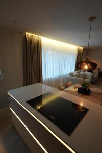a living room with a couch and a table at 1st Floor Luxury 2-Bed Apt Sleeps 6 in St. Andrews +13 photos