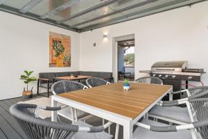a dining room with a wooden table and chairs at HOMEBASE - Design Lofts am Schloss in Montabaur
