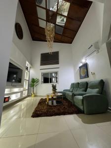 a living room with a couch and a table at Afraah guest house in Yaoundé