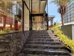 a building with a staircase leading up to a building at The Iconic in Pattaya