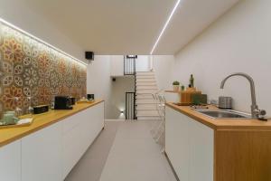 a kitchen with a sink and a counter top at Suite 1926 Luxury Room in Triggiano