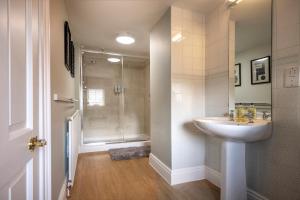 a bathroom with a sink and a shower at West House in High Legh +14 photos