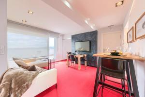 a living room with a couch and a table at Apartamento Bilbao Aeropuerto - Derio in Derio