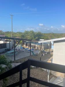 a balcony of a house with a playground at Royal Rat Hostel in Placencia