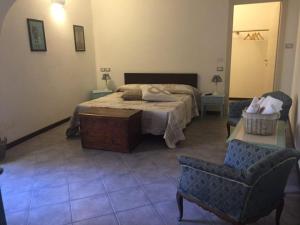 Al Castello Affittacamere tesisinde bir odada yatak veya yataklar