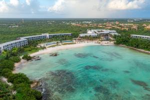 an aerial view of a beach and a resort at Conrad Tulum Riviera Maya in Tulum +117 photos