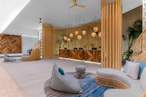 a living room with a couch and a table at Hilton Tulum Riviera Maya All-Inclusive Resort in Tulum