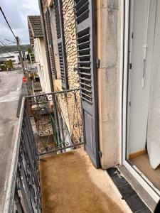 an open door to a balcony on a building at Savane 2 bedrooms and private parking in Vesoul