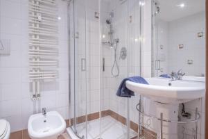 a bathroom with a shower and a sink and a toilet at Long John Apartment in Rome +43 photos