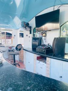 an rv kitchen with a counter and a table at Fields Palace Hotel in Angeles