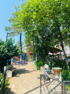 a park with benches and a playground at Welcome2 in Kobuleti +3 photos