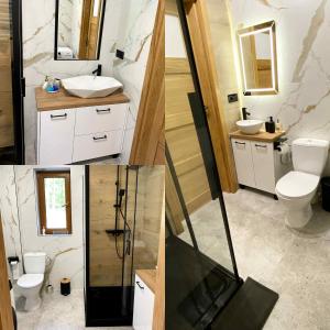 a bathroom with two toilets and a tv in it at Radość o poranku in Smardzew