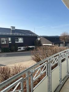 a fence in front of a house at Upland-Living in Willingen