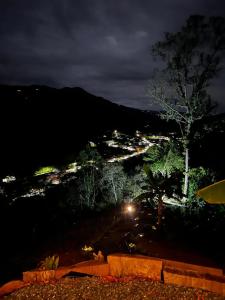 a view of a city at night at Glamping Villa JuanMa in Salónica