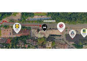 a map of a street with three signs on it at ApartHotel Slumber in Geesthacht