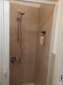 a shower with a shower head in a bathroom at Il sottano borgo antico in Bari +33 photos