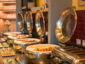 a buffet line with many plates of food at B&B HOTEL Inverness in Inverness
